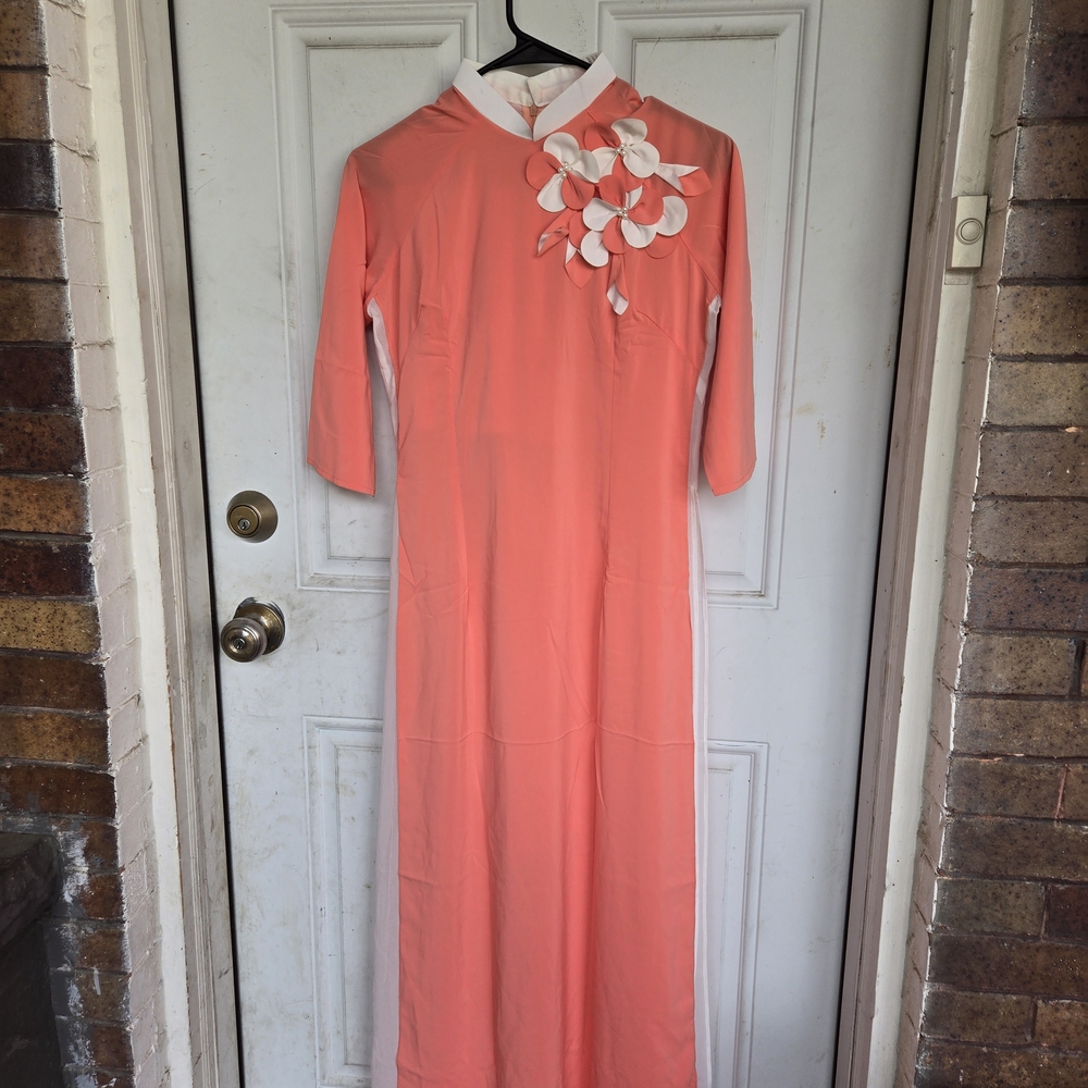 Elegant Coral Dress with Floral Detail